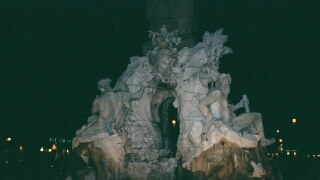 Piazza Navona Central Fountain at Night: The central fountain of the Piazza is by Bernini.  His figures are said to be recoiling in aesthetic horror from the church directly opposite, which was designed by one of Bernini's rivals.