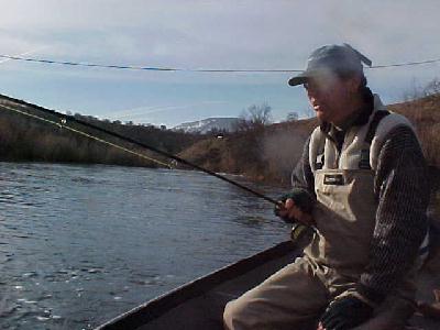 John Swain playing a steelhead: