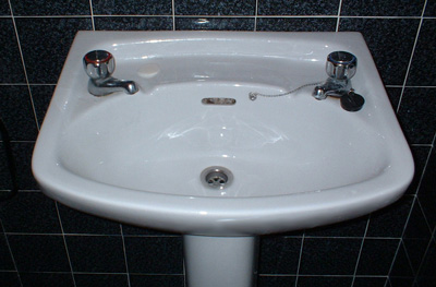 Sink Plumbing on Sink From Two Faucets To One    Bathroom Sink Plumbing   Ask